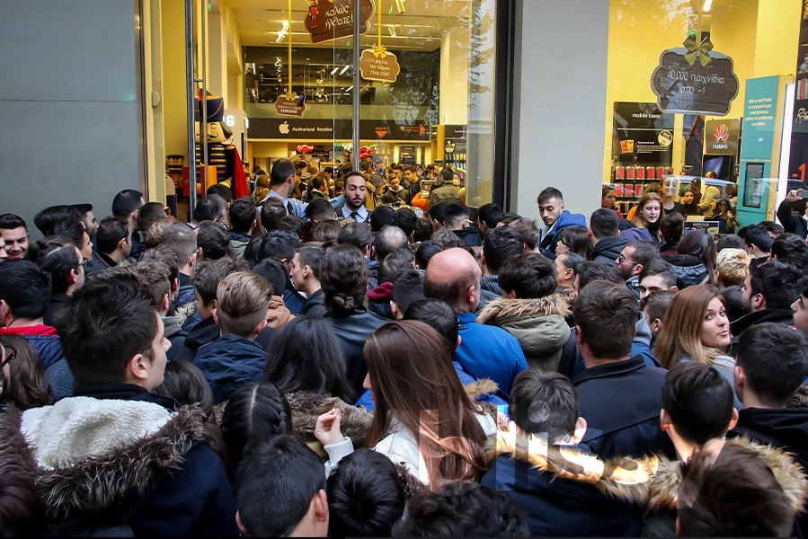 Black Friday crowds of shoppers congregate around store